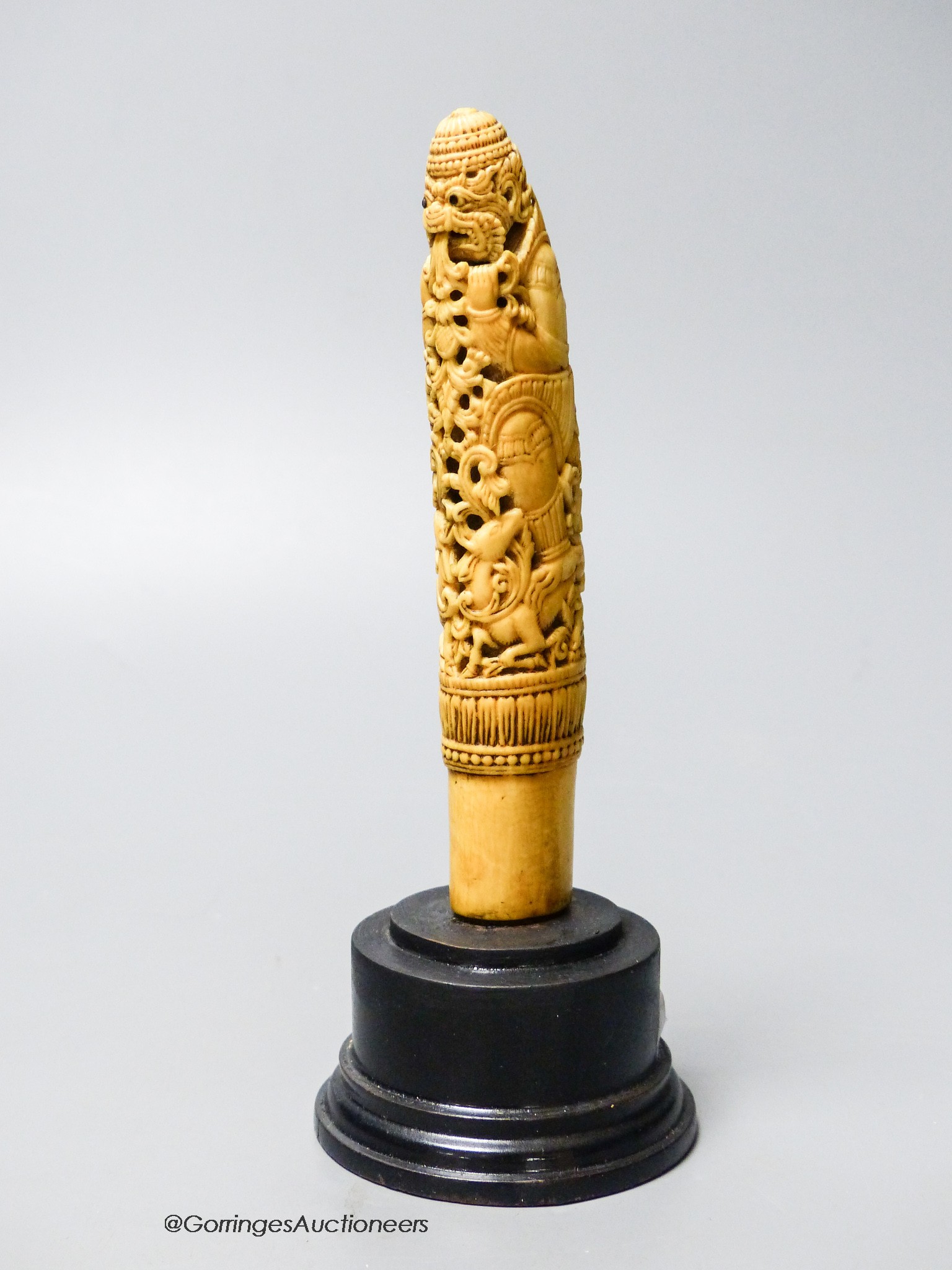 A 19th century Indonesian ivory Dha handle, on plinth, height 18cm